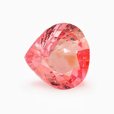 Loose pinkish orange sapphire, pear cut, 1.06 ct, with visible inclusions, on a white ground