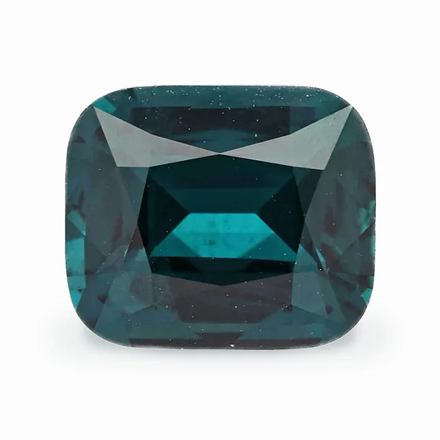 Loose spinel, dark bluish green, cushion cut, 3.11 ct, on a white ground