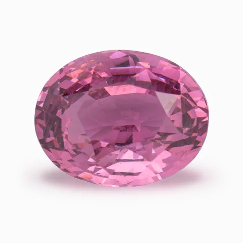 Loose pink stone, oval cut, on a white ground