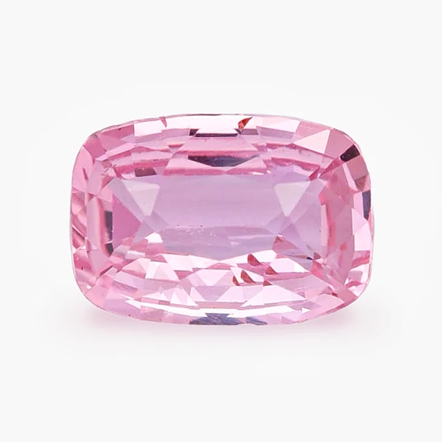Loose sapphire listed as padparadscha, 1.35 ct, cushion cut, on a white ground